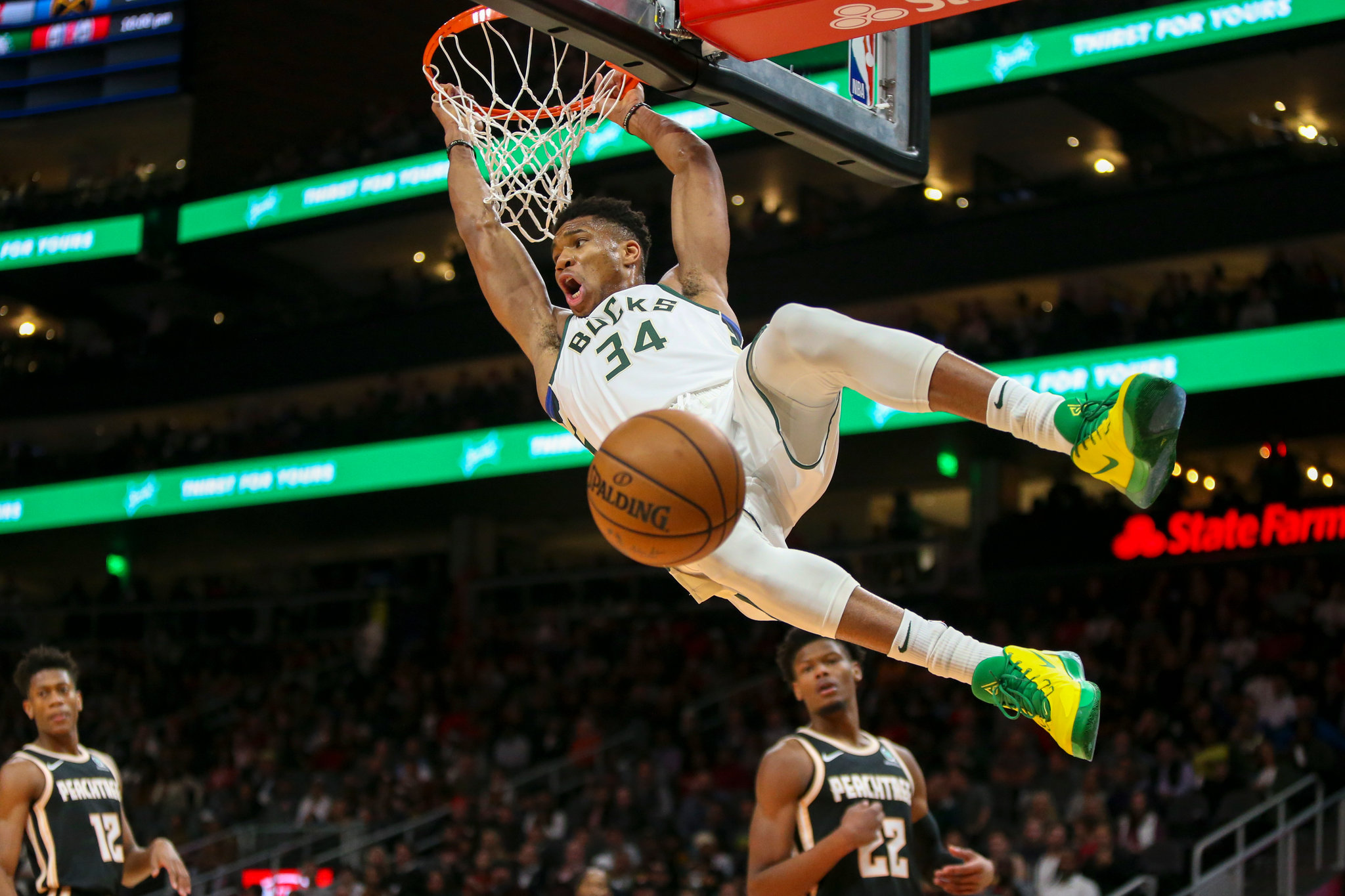 Basketball player making a dunk during a game